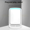 White air purifier with blue light on a gray background
