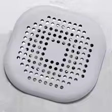 Metallic square filter with circular holes on a white background